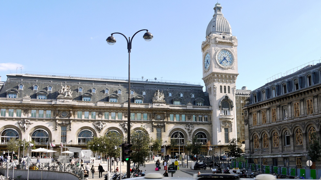 Gare de Lyon Paris historic railway station façade with clock tower, a major European train hub.
