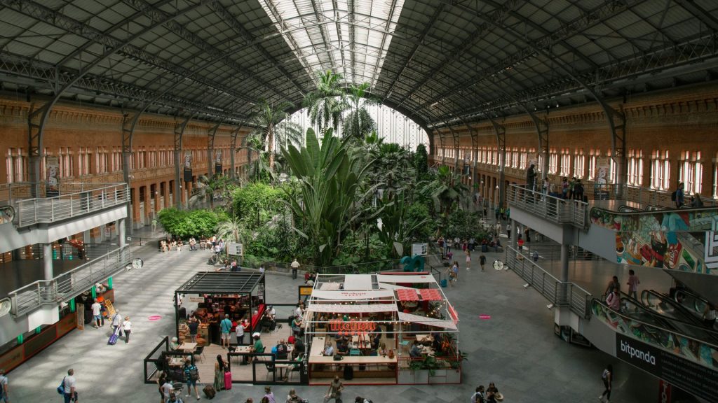 Madrid Atocha Station historic iron-and-glass façade with interior tropical garden, one of Spain’s most beautiful railway stations.