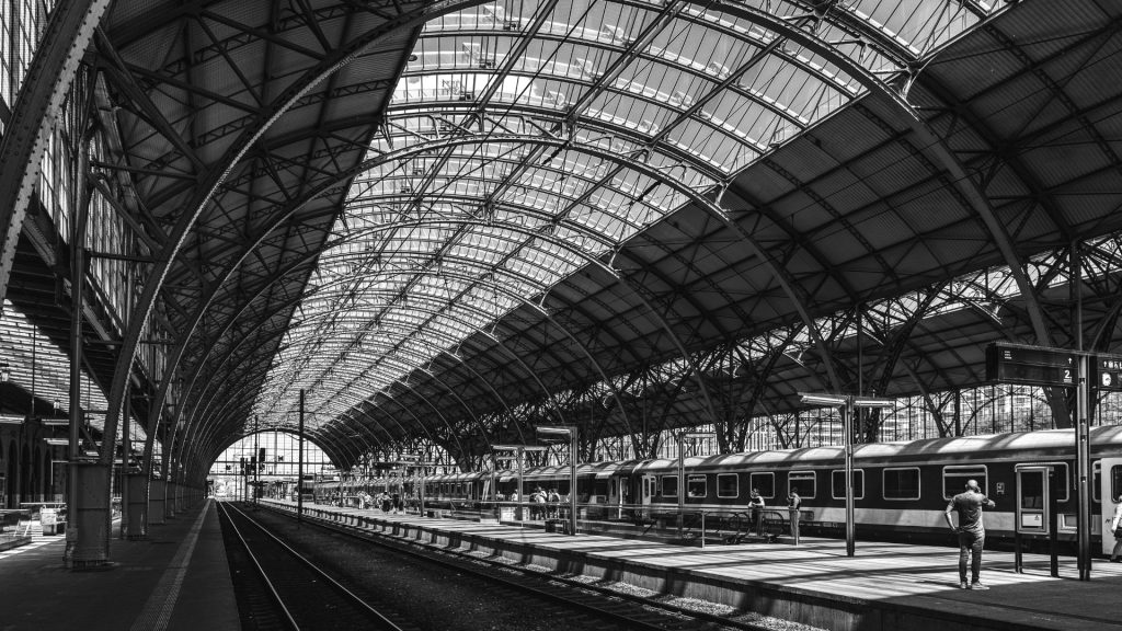 Prague hlavní nádraží historic Art Nouveau railway station with ornate façade and classic European train design.