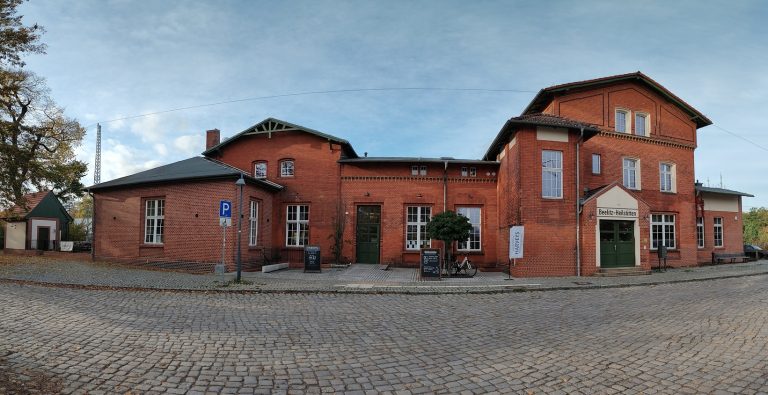 Abandoned Beelitz-Heilstätten railway station in Germany with historic brick architecture, a key example of forgotten European railways and ghost train routes.